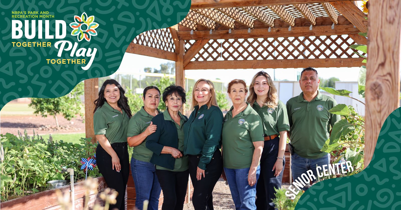 The build play team smiles together for a group photo, showcasing their teamwork and camaraderie.